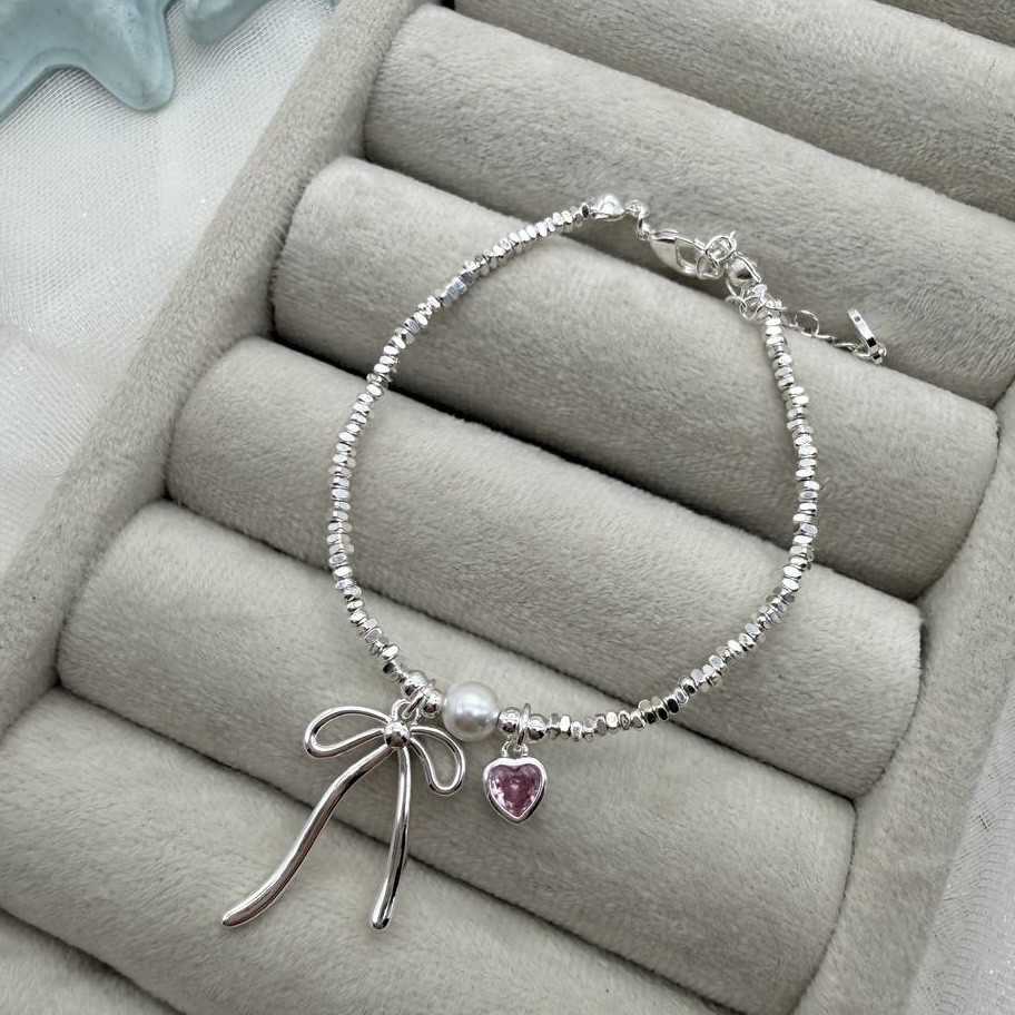 دستبند آویز دار پاپیون و قلب و مروارید
